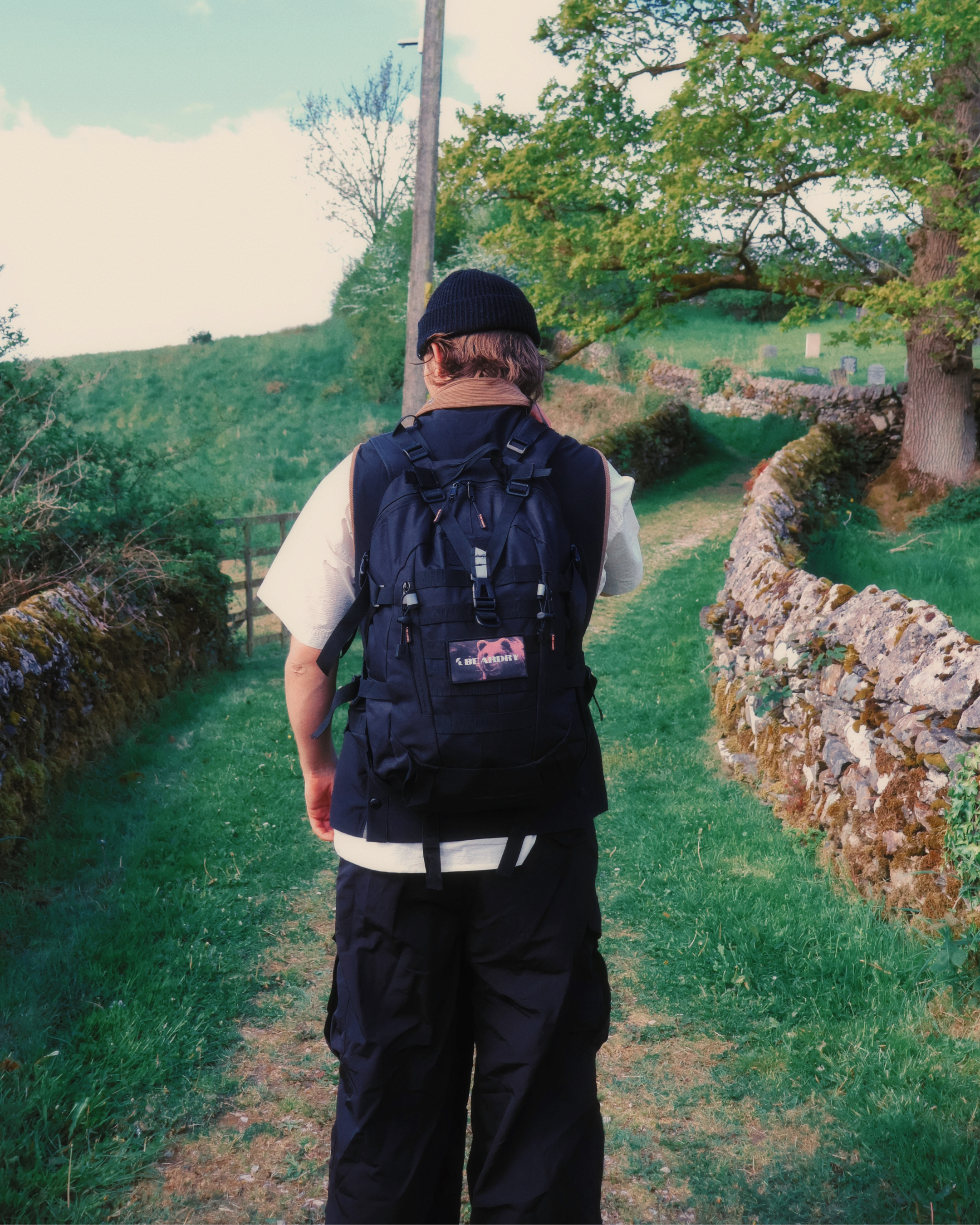 Everyday Water-Resistant Backpack 25L - Onyx Black with Crimson Bear